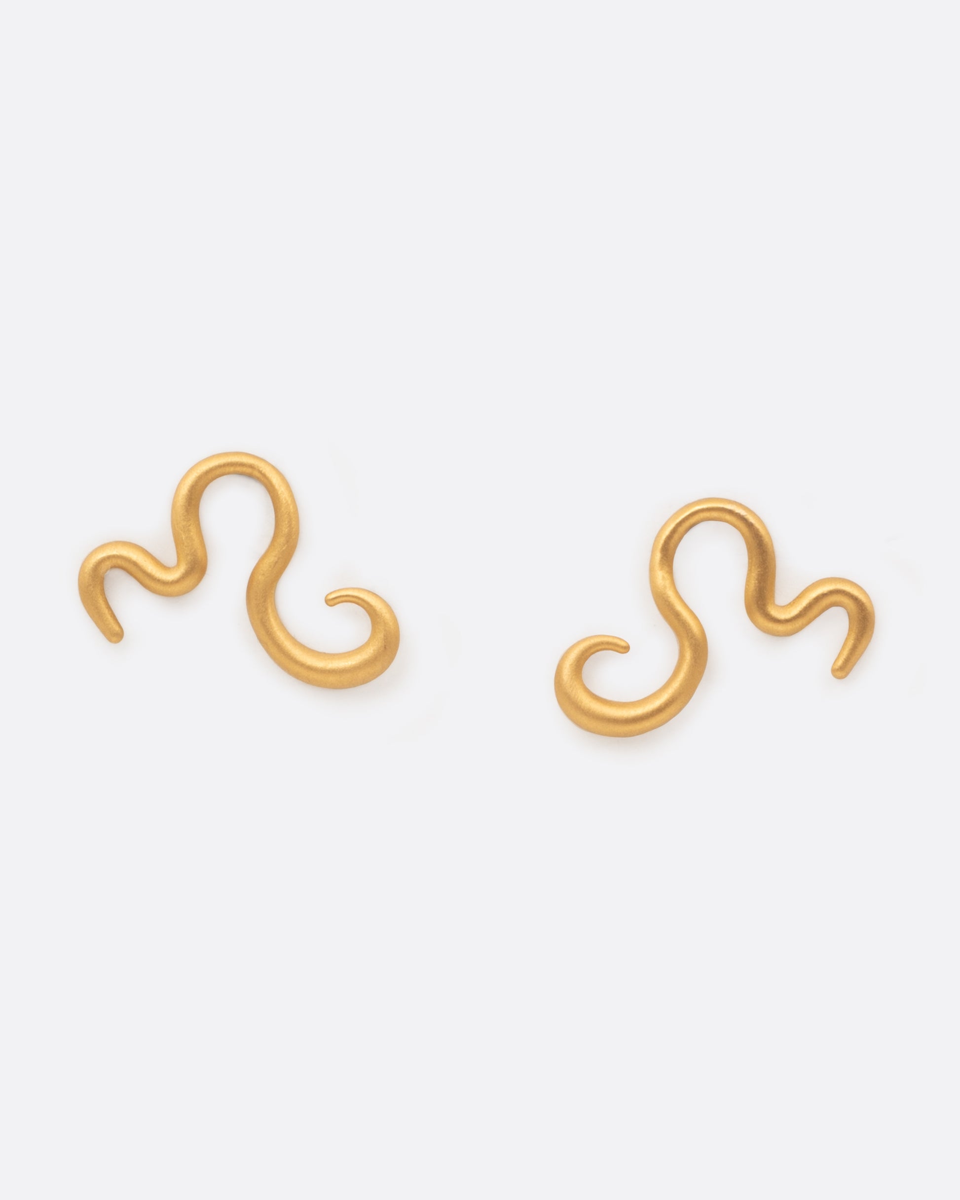Curved 22k yellow gold snake stud earrings, shown as a pair.
