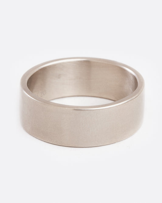 Front view of a simple, thick white gold band with matte finish