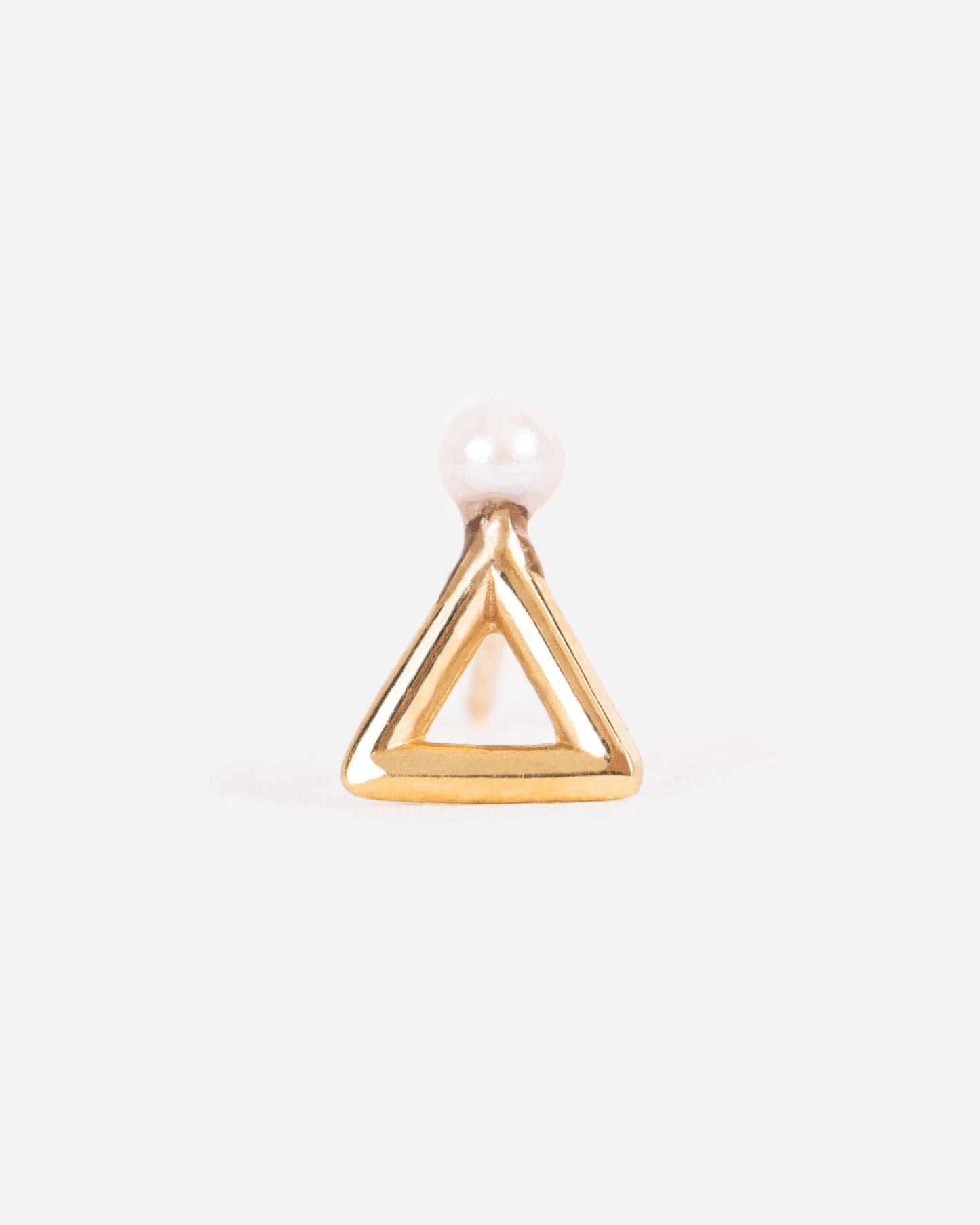 A single earring, the face is a yellow gold open triangle with a seed pearl on top.