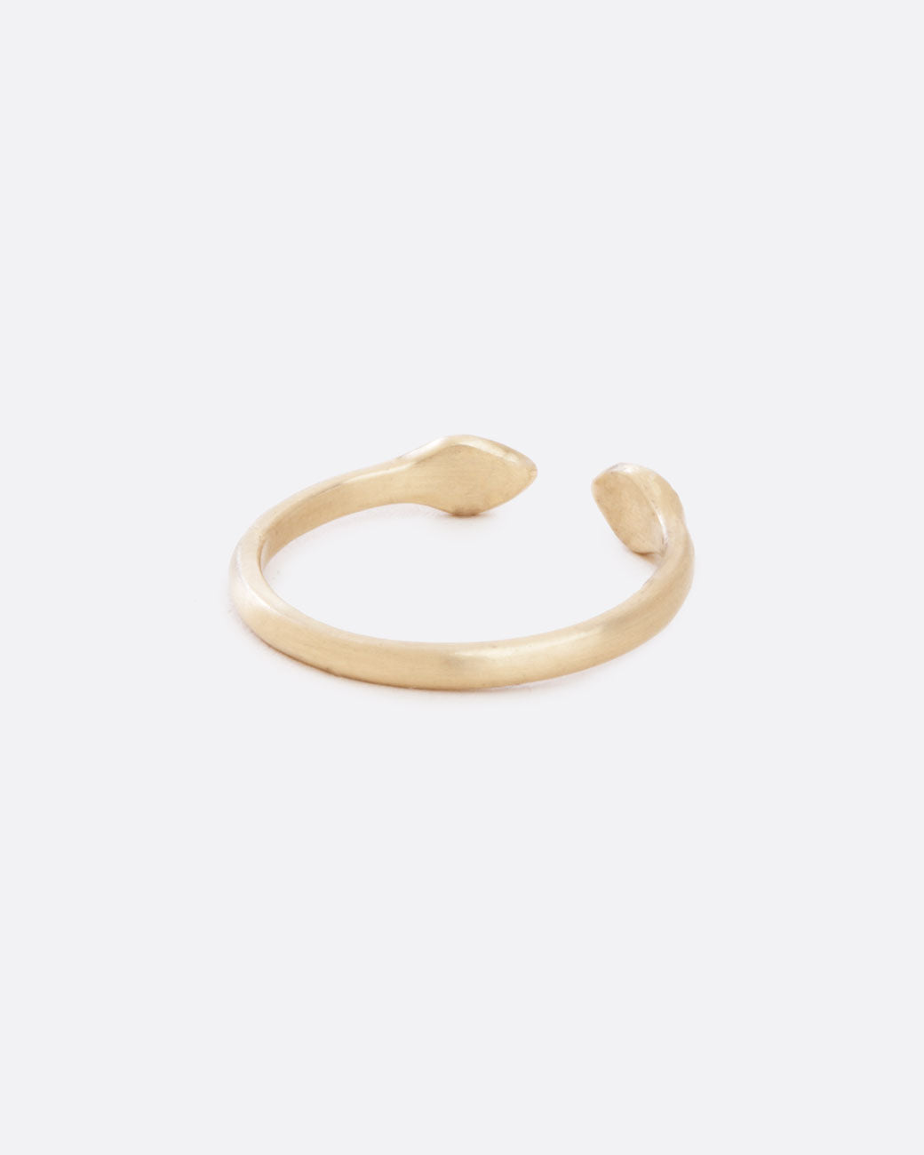 A back view of a simple and matte ring with an open front. The front pieces are more bulbous than the band.