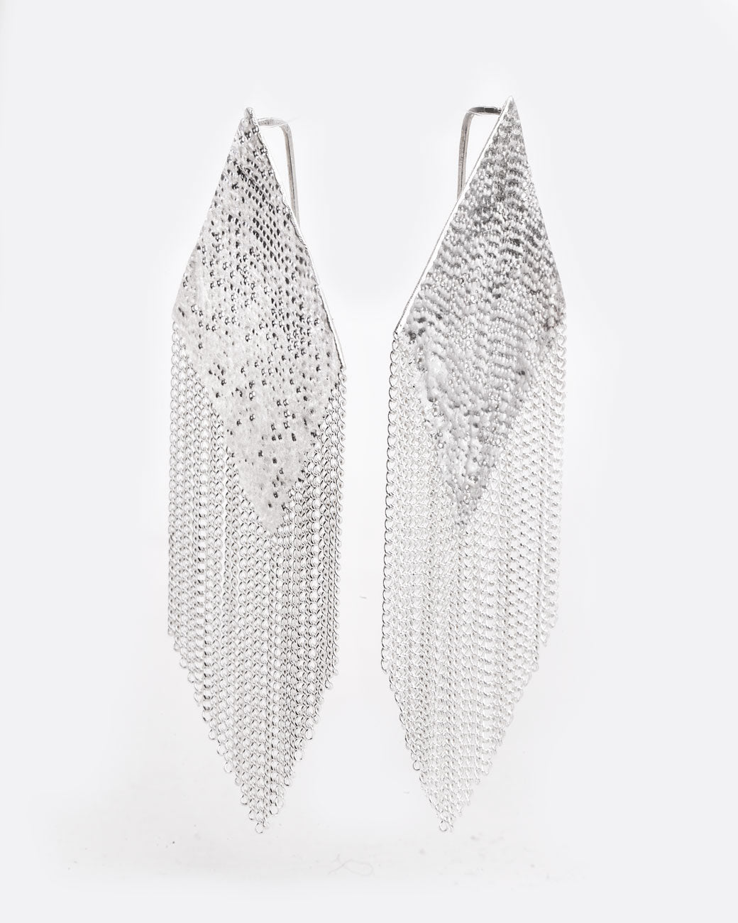 angle view of silver earrings from the side