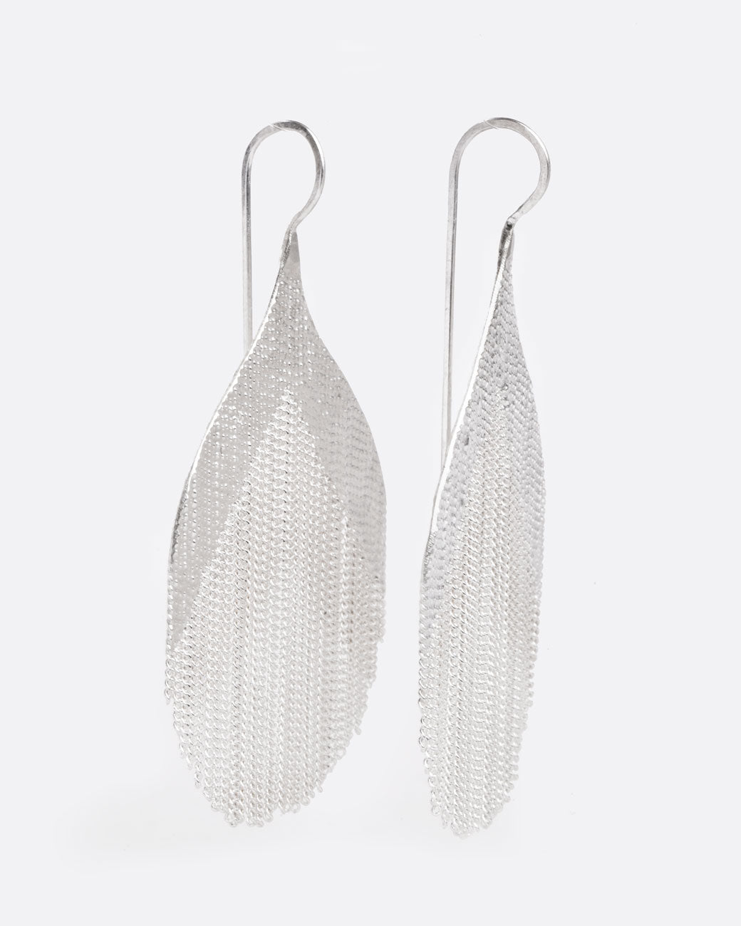 whale tail shaped earrings with a number of dangling chains in the middle