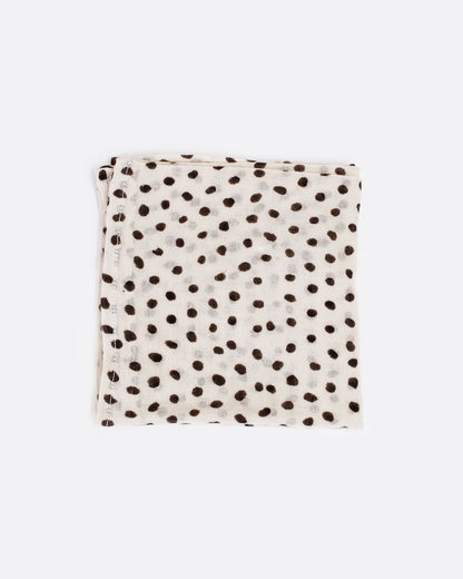 Cream bandana with black polka dots, shown folded.