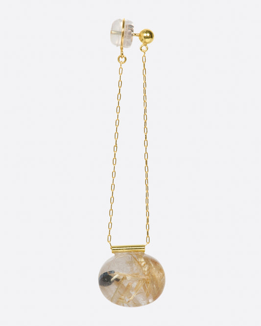 A stud earring with a chain drop, featuring an oval gold rutilated quartz.