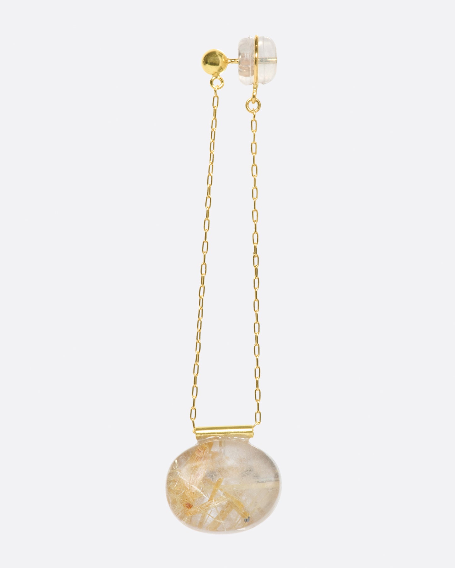 A stud earring with a chain drop, featuring an oval gold rutilated quartz.