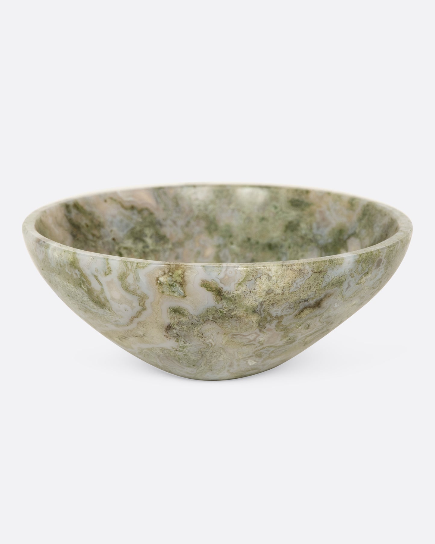 A little bowl with swirled shades of green and blue.
