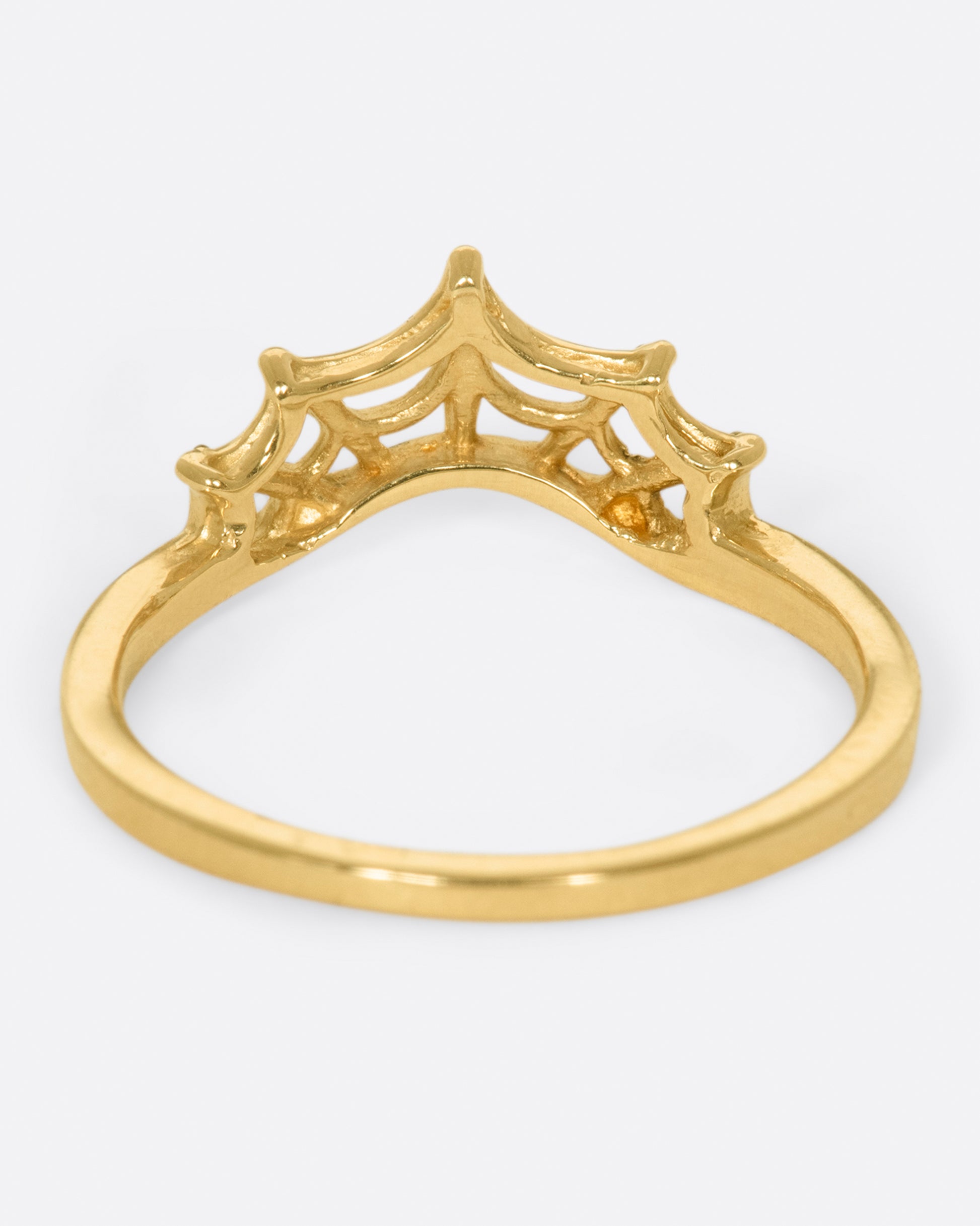 yellow gold ring with curved spider web with pave diamonds by Margaret Cross