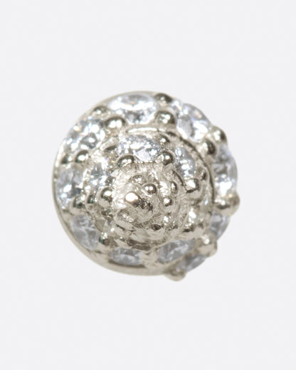 A white gold conical stud earring, with diamond accents, shown from the front.