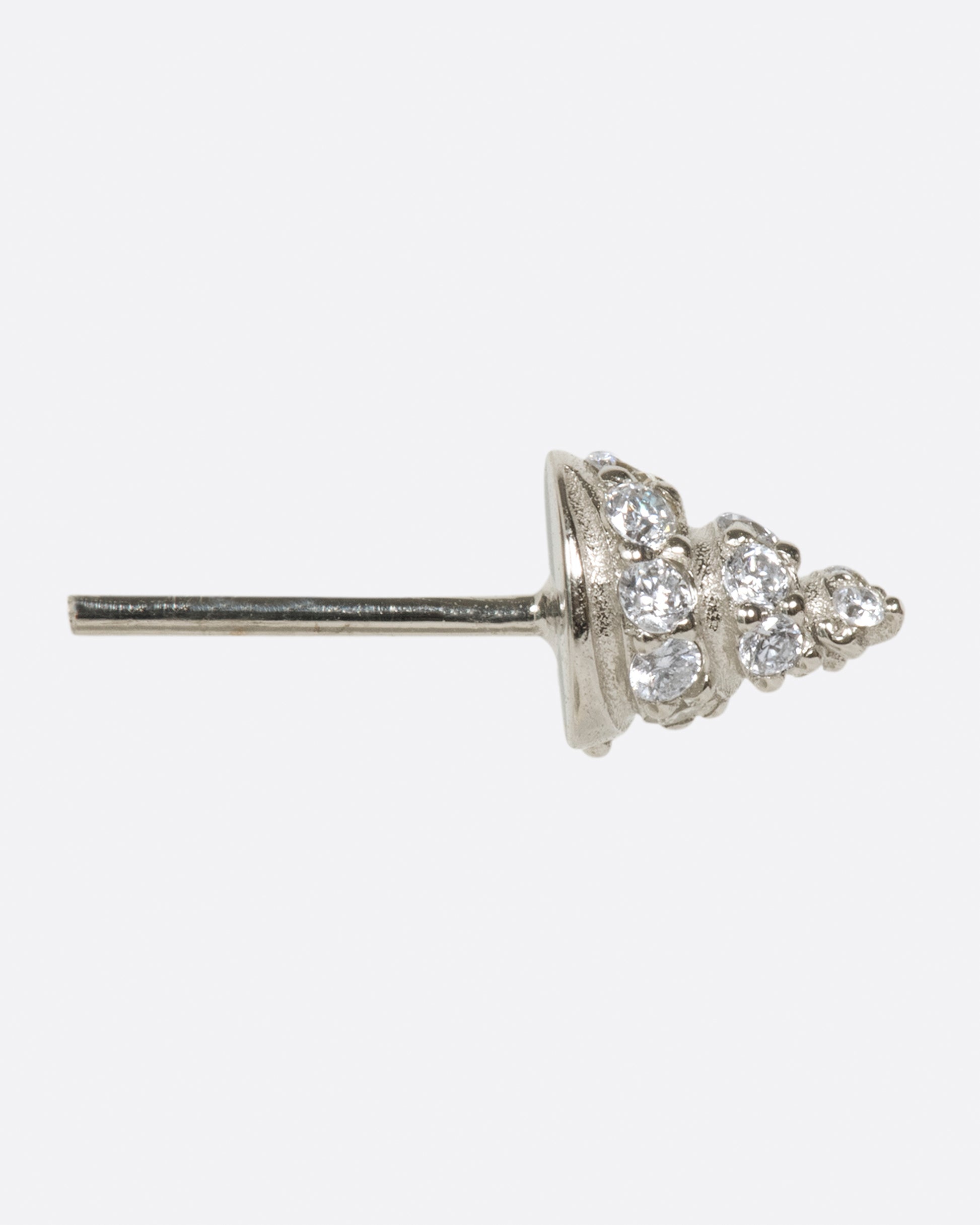 A pointed stud, in your choice of gold, with diamonds wrapped around it.