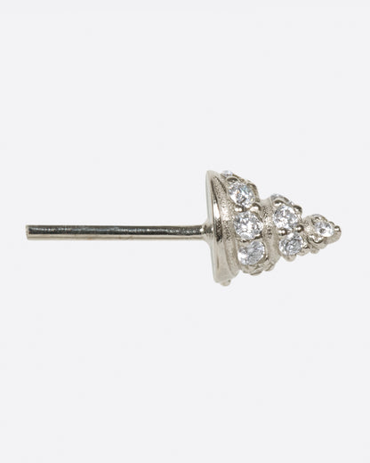 A white gold conical stud earring, with diamond accents, shown from the side.