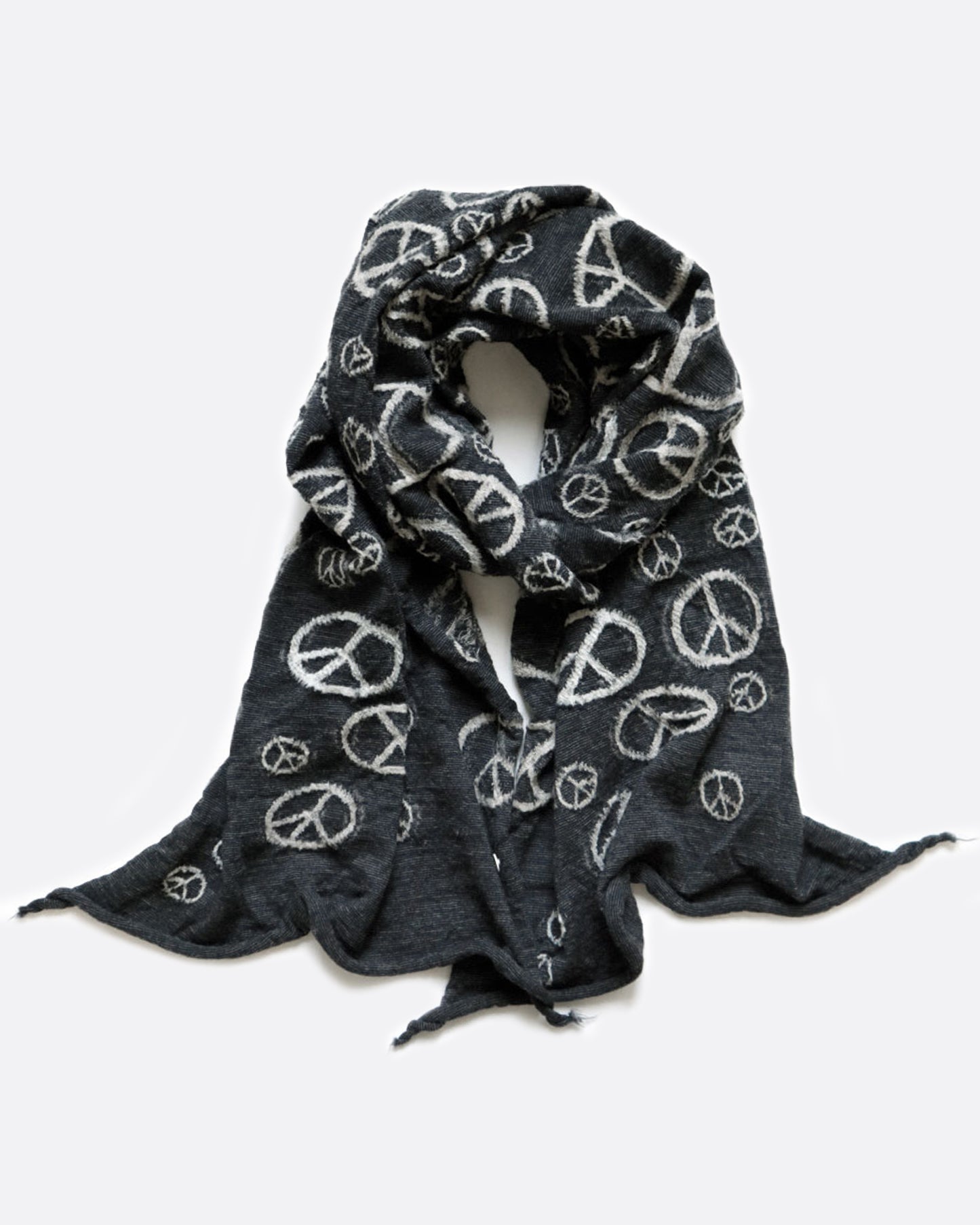 A black scarf with white peace signs, shown wrapped.