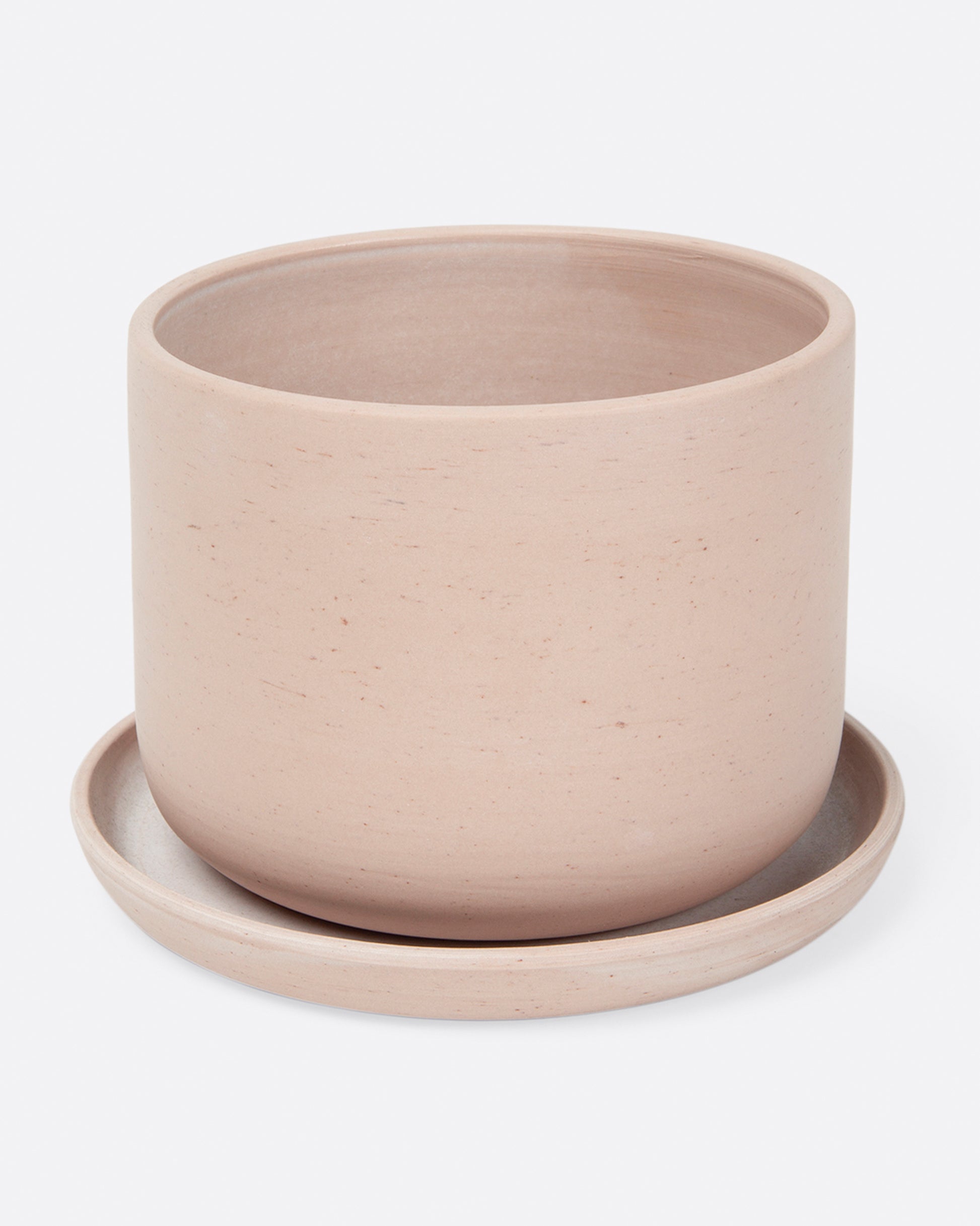 Smooth, matte, tinted porcelain planters with matching saucers.
