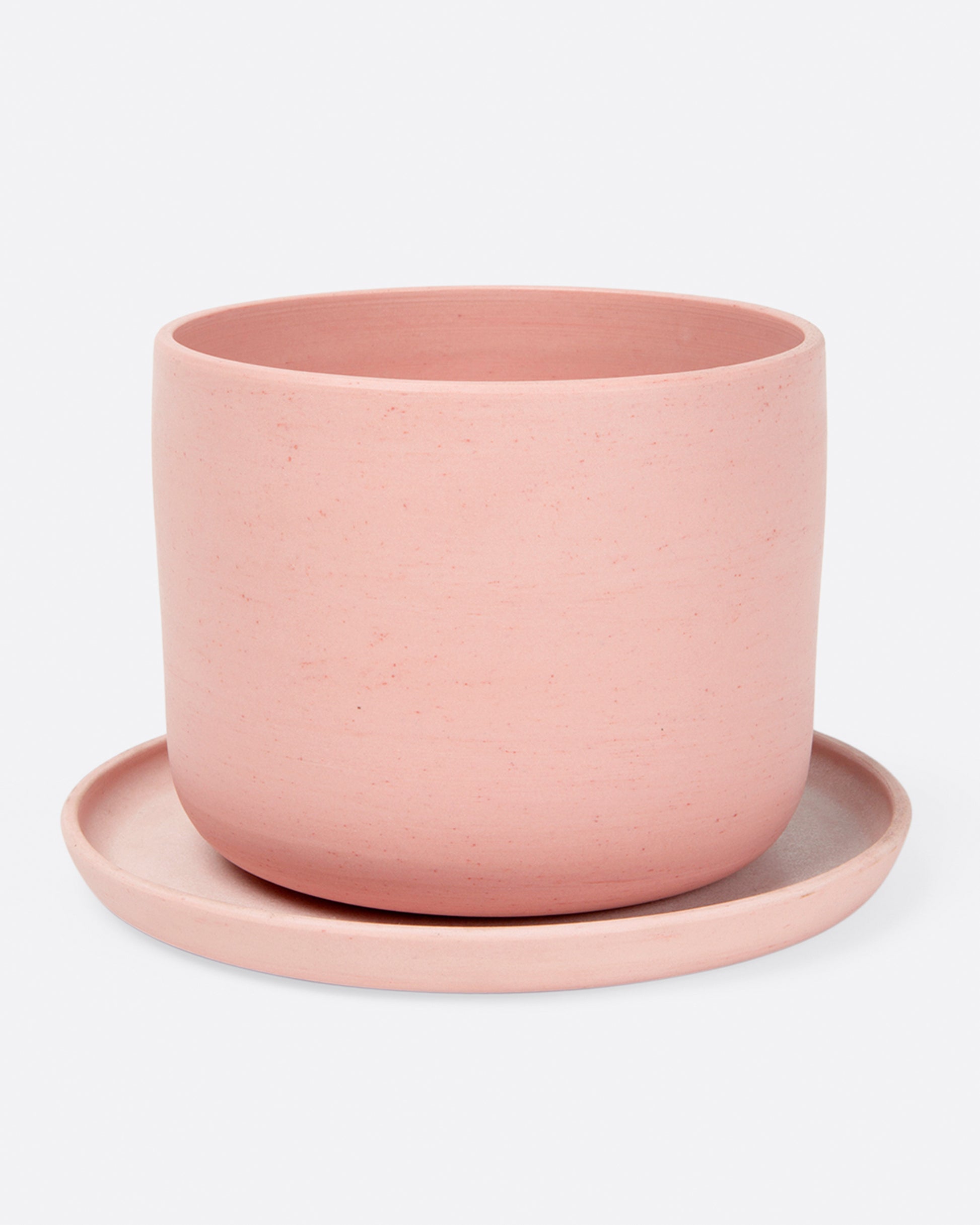 Smooth, matte, tinted porcelain planters with matching saucers.