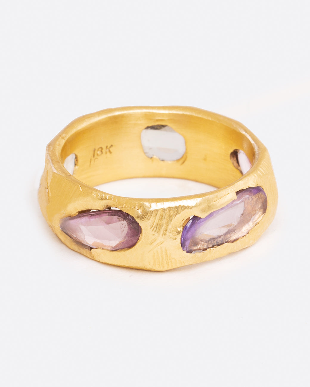 Brushed gold sapphire band with purple sapphires, shown from the front.