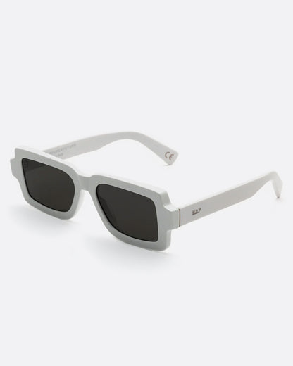 Rectangular white framed sunglasses, shown from the side open.