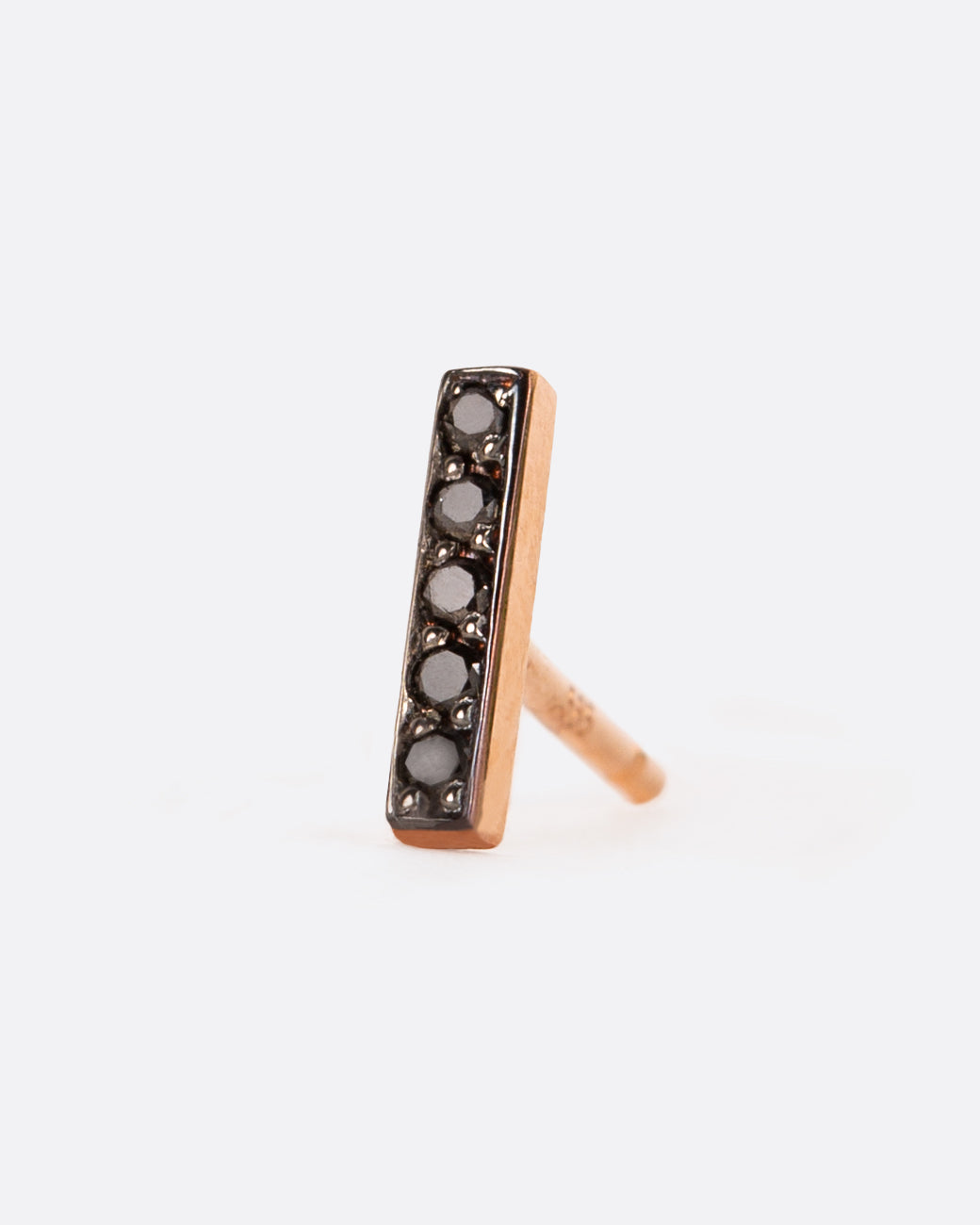 a single black bar with black diamonds set into it, a rose gold post back is visible in the back