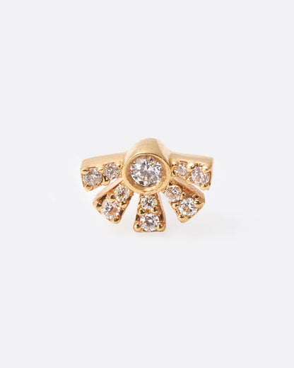 A yellow gold earring in the shape of a sun with rays with diamonds inlaid throughout. Shown from the front.