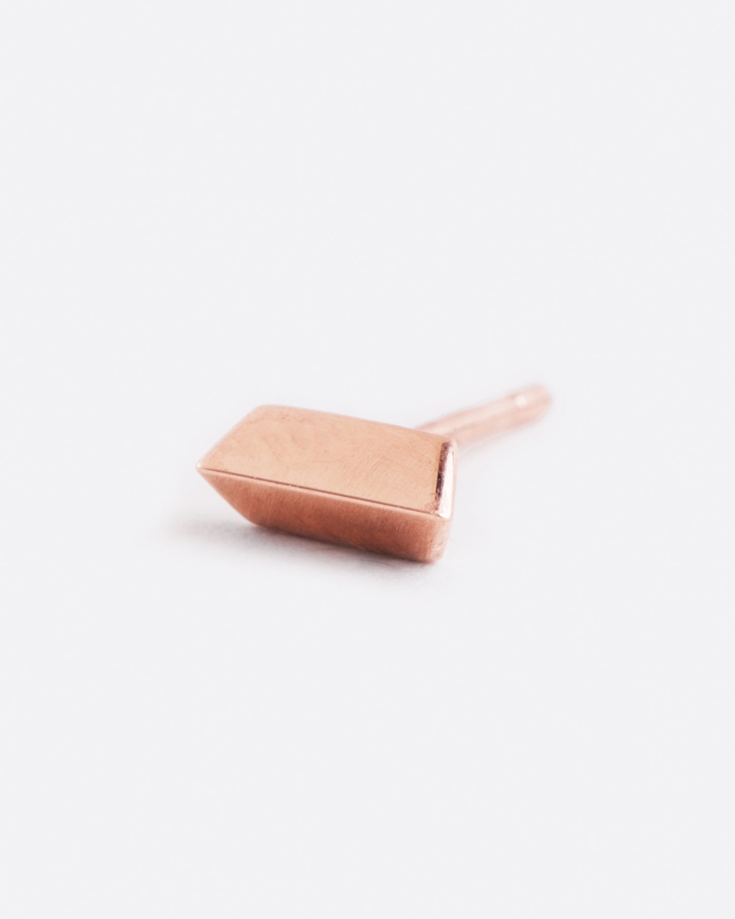 14k rose gold angled bar stud earring by Selin Kent, shown from the front.