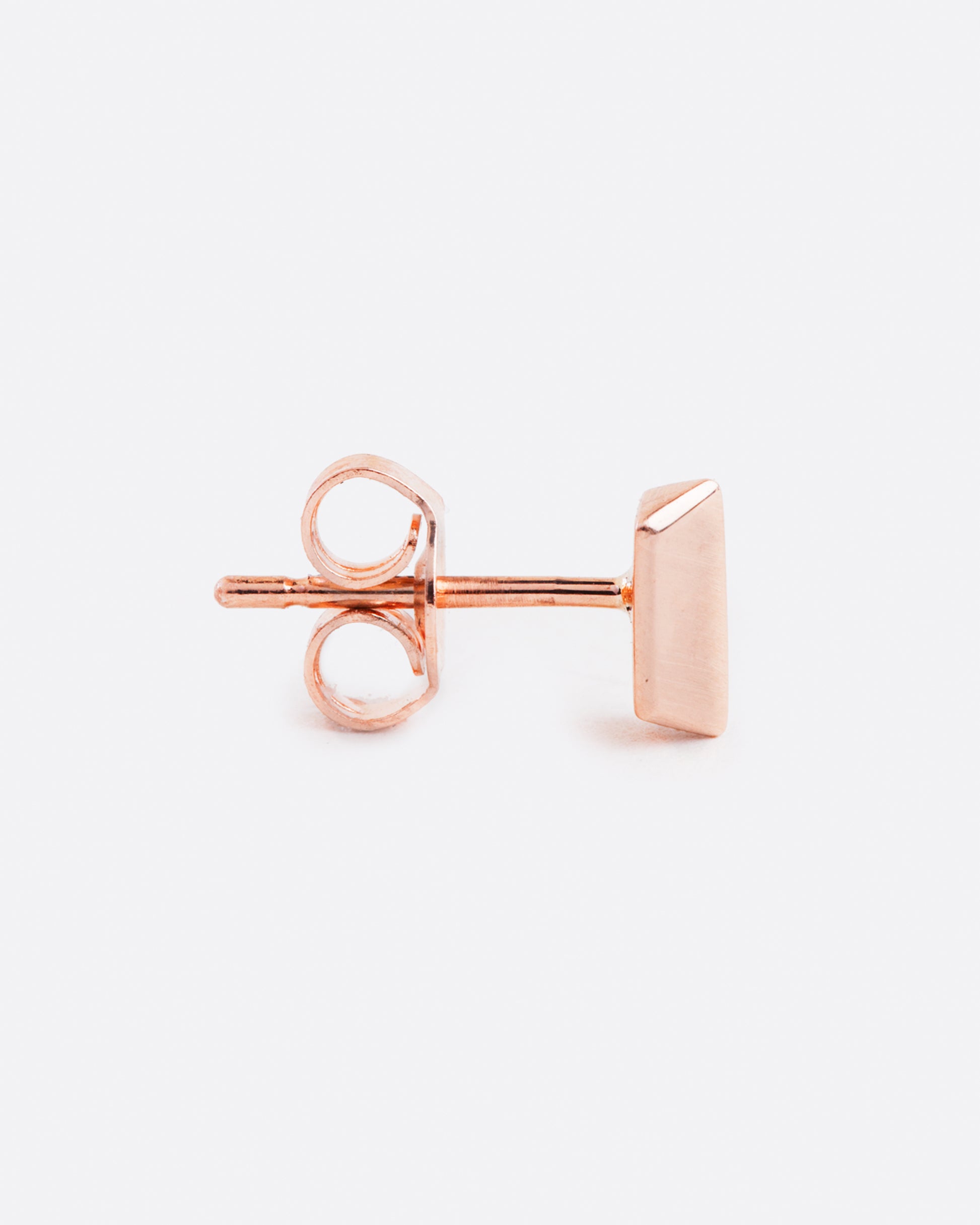 14k rose gold angled bar stud earring by Selin Kent, shown from the side.