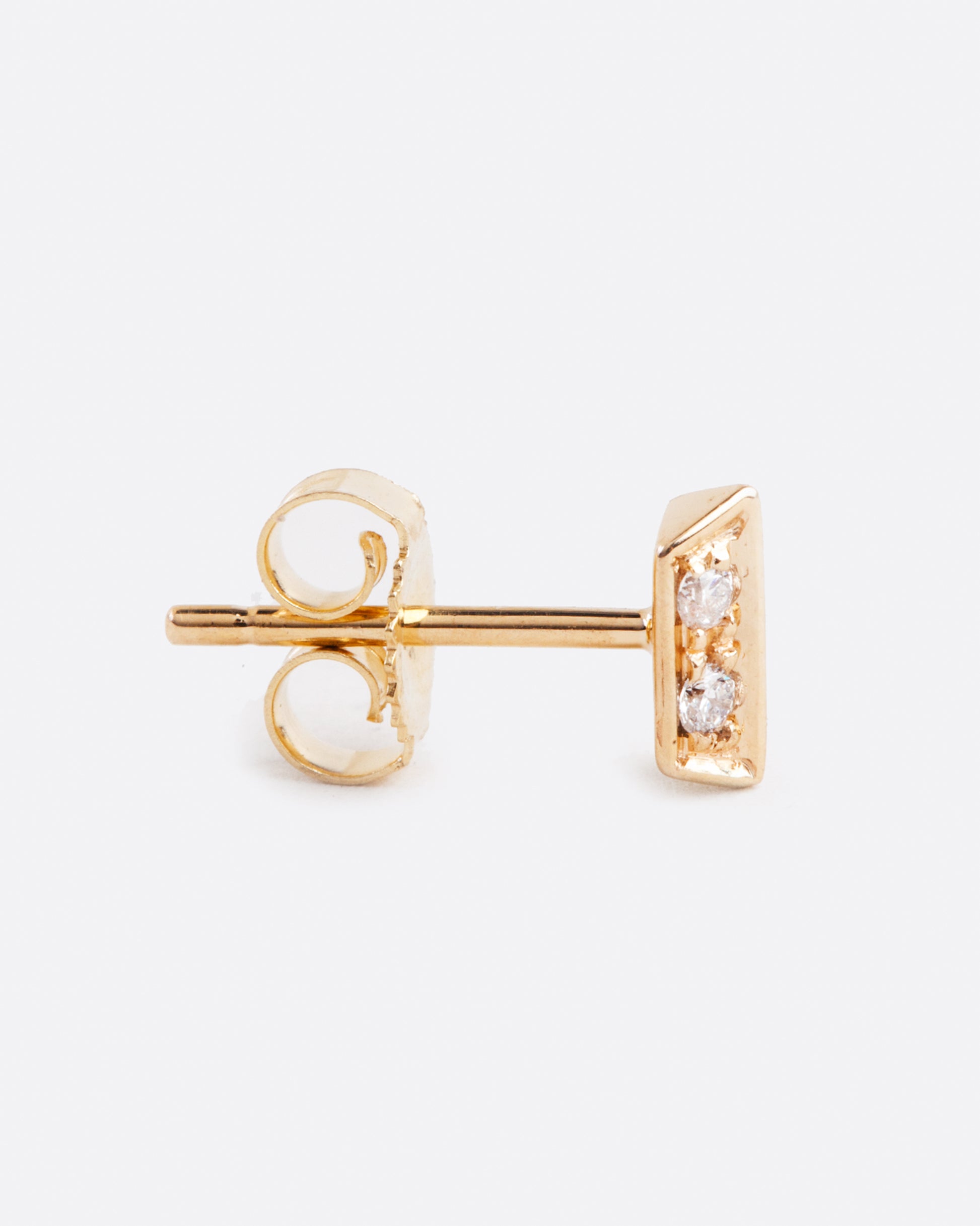 14k yellow gold angled bar stud earring with diamonds by Selin Kent, shown from the side.