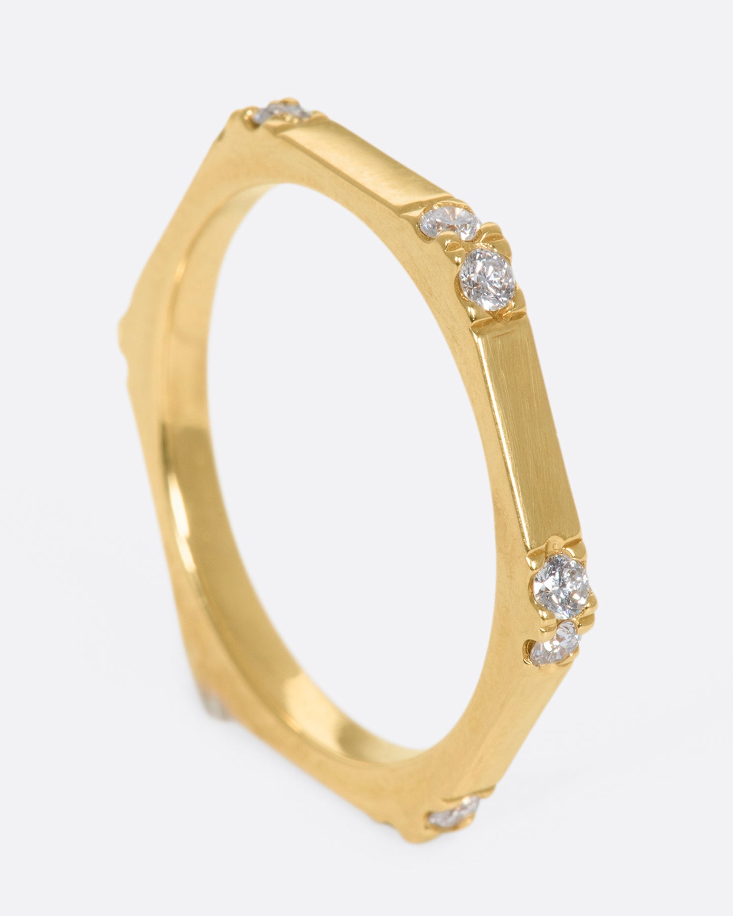 A hefty, hexagonal ring with diamond on each corner.