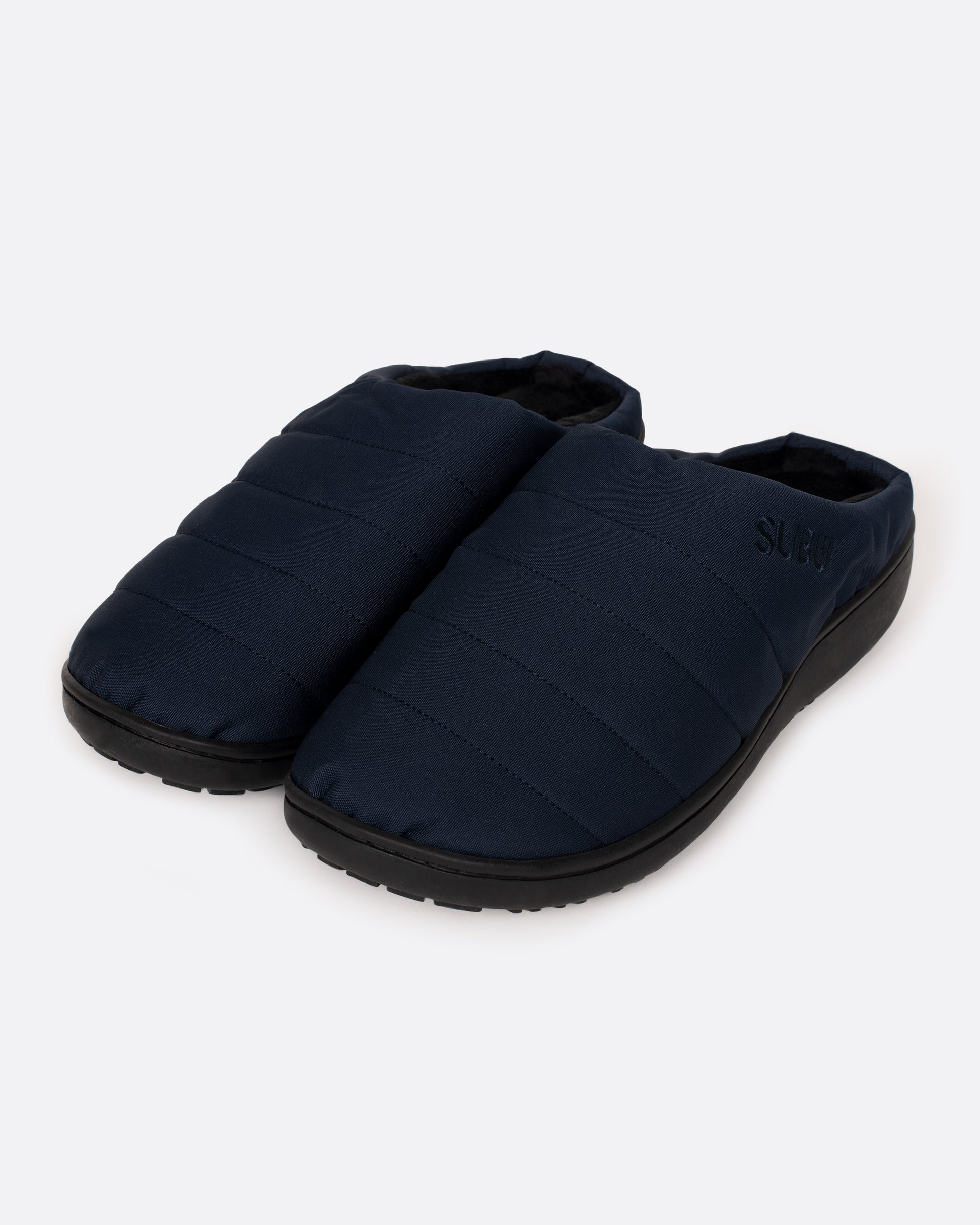 A pair of navy nylon slippers with black rubber soles, shown from the side.