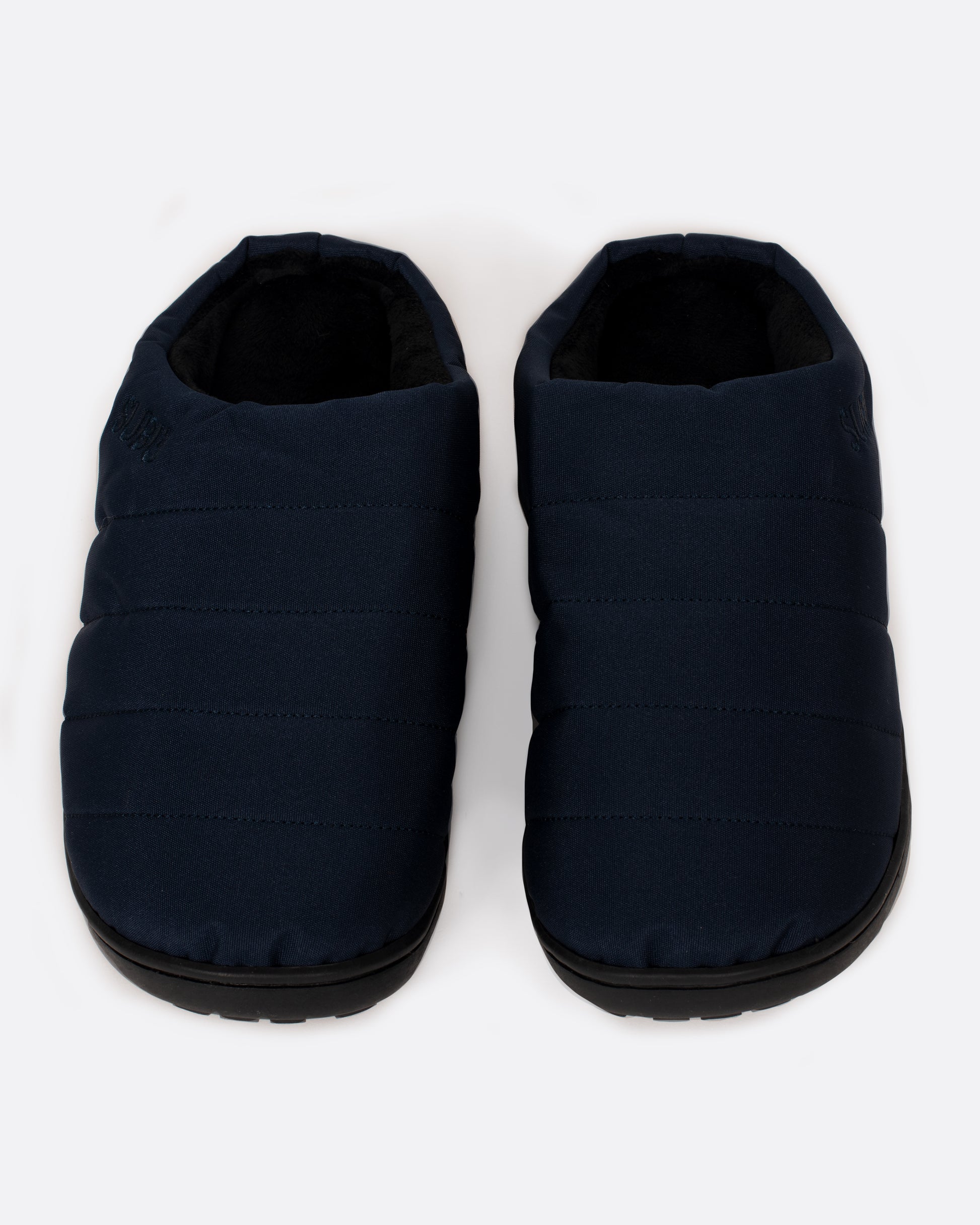 A pair of navy nylon slippers with black rubber soles, shown from the front.
