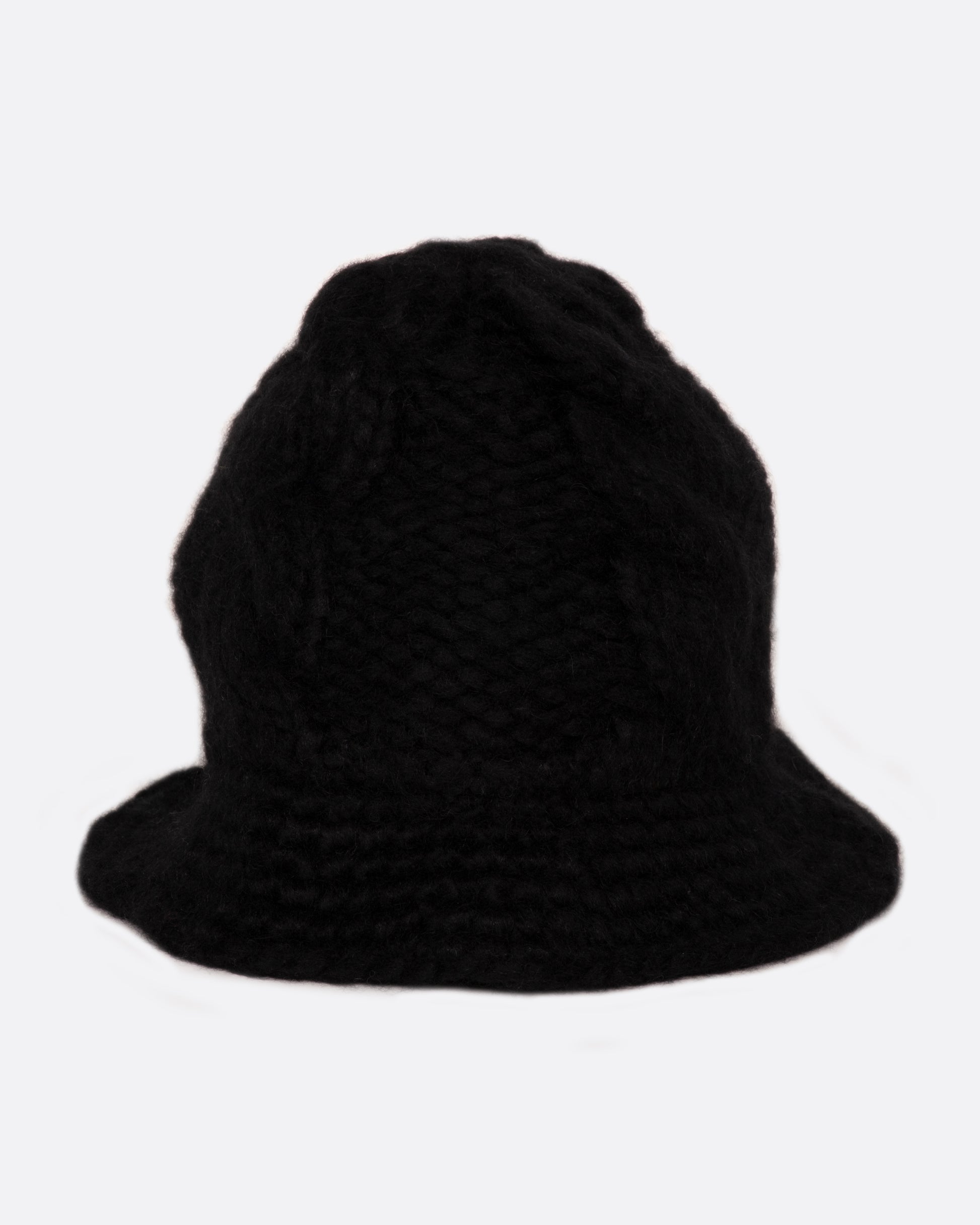 A chunky cable knit bucket hat with a narrow brim.