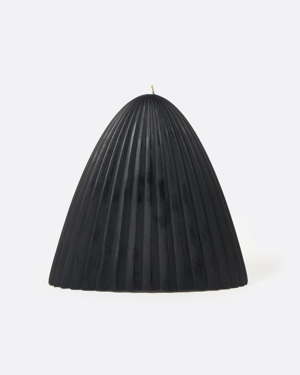 Black natural beeswax tusk candle, short and wide.