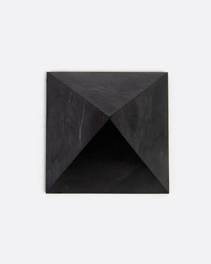 A black stone pyramid. Shown from the top.