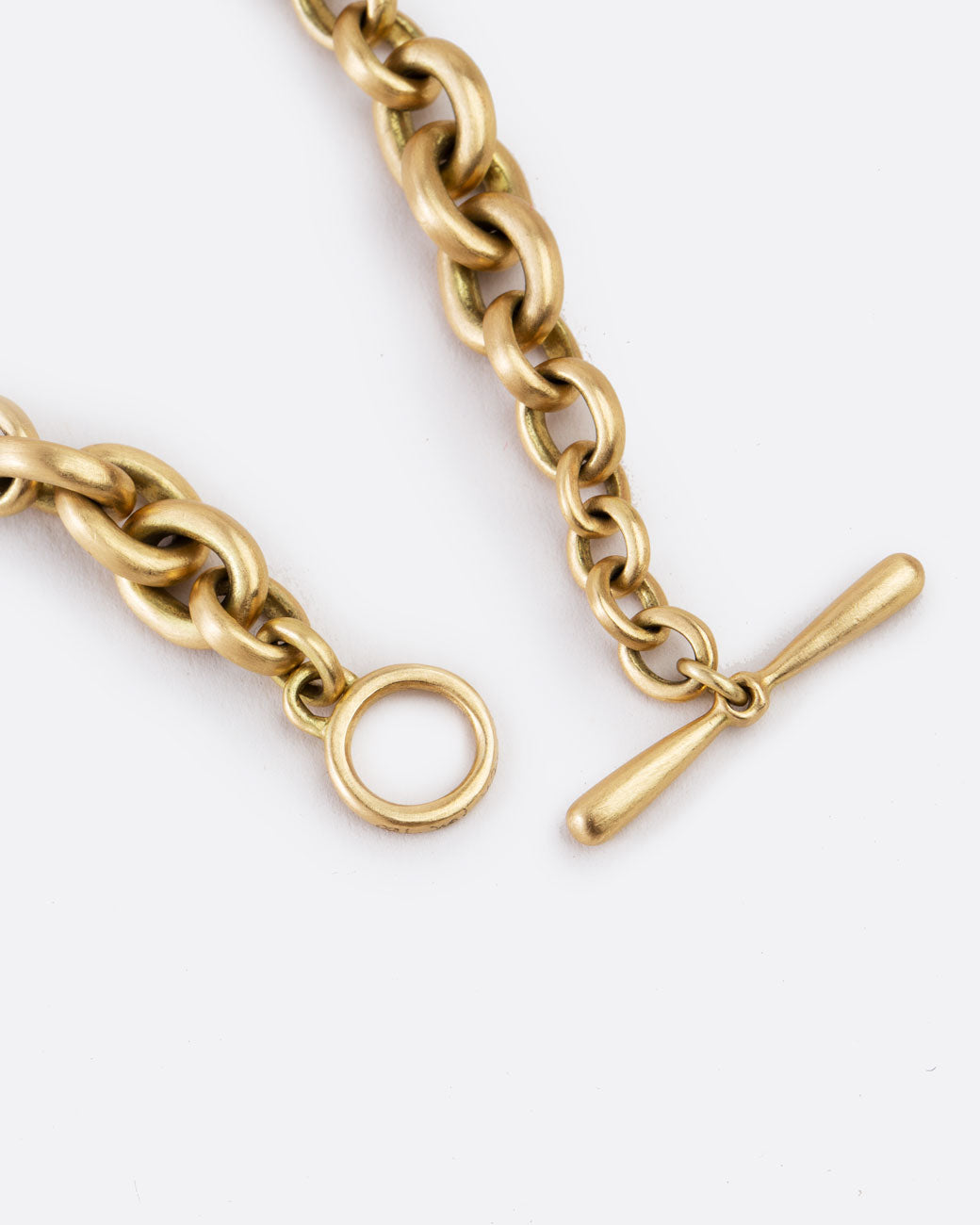 medium link bracelet of matte gold - close up on toggle clasp