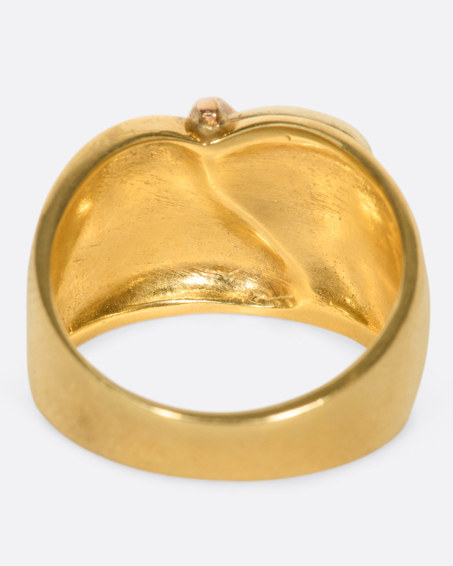 A wide, dimpled yellow gold band with white and rose gold teardrop accents.