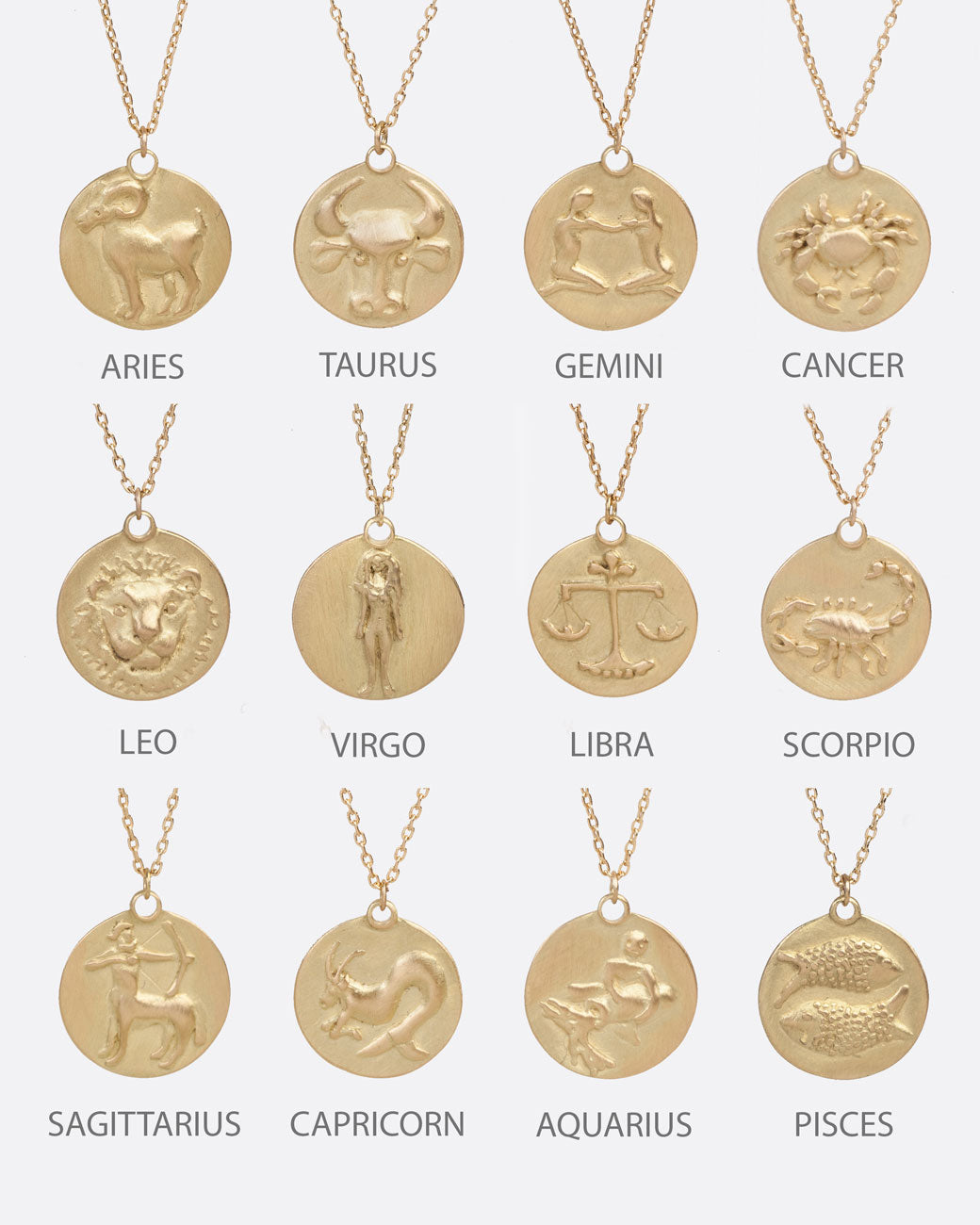 Chart depicting all twelve zodiac designs on yellow gold disc pendants 