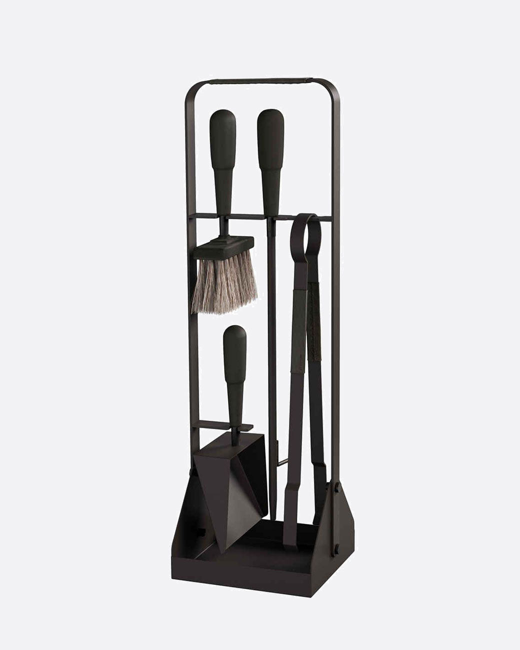 black fireplace set with four pieces hanging on the frame. there are black leather details on the handles. 